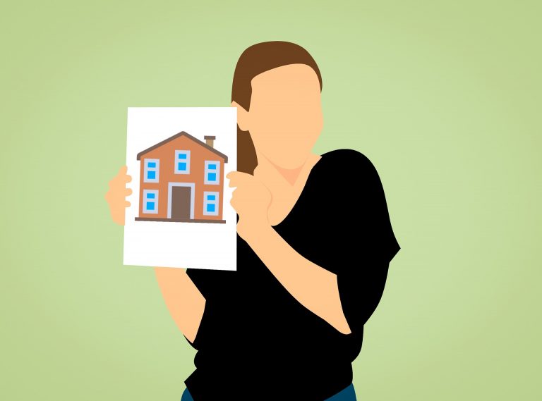 realtor holding image of house